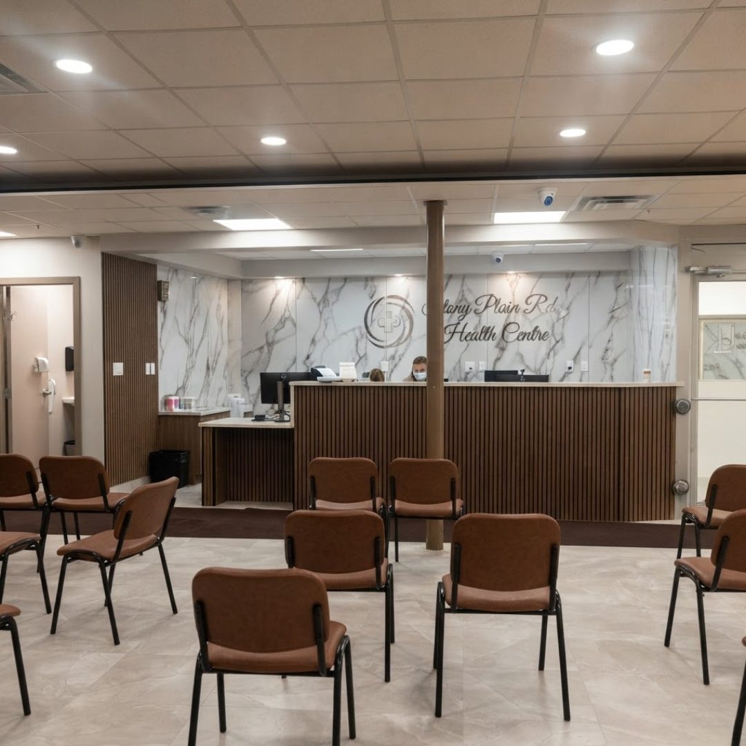 Reception desk with Stony Plain Rd. Health Centre branding